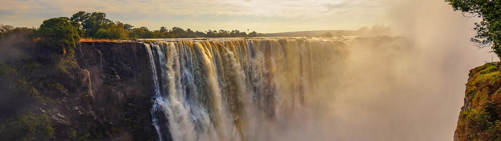 A panorama view of the powerful Victoria Falls that can be seen on a Zambia safari vacation